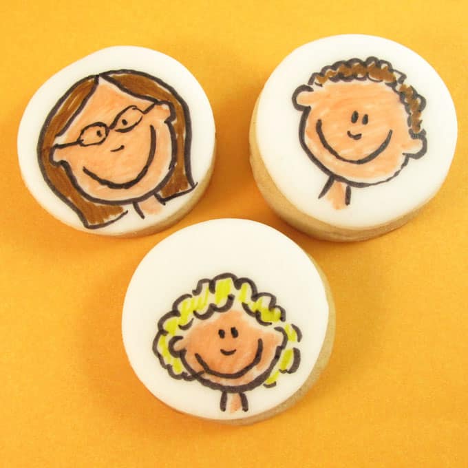 Family Portrait Cookies: Decorate cookies with food coloring pens personalized with your family or pets. Also, how to draw cartoon faces. #cookiedecorating #familycookies #familyportrait #howtodrawcartoons #cartoonfaces 