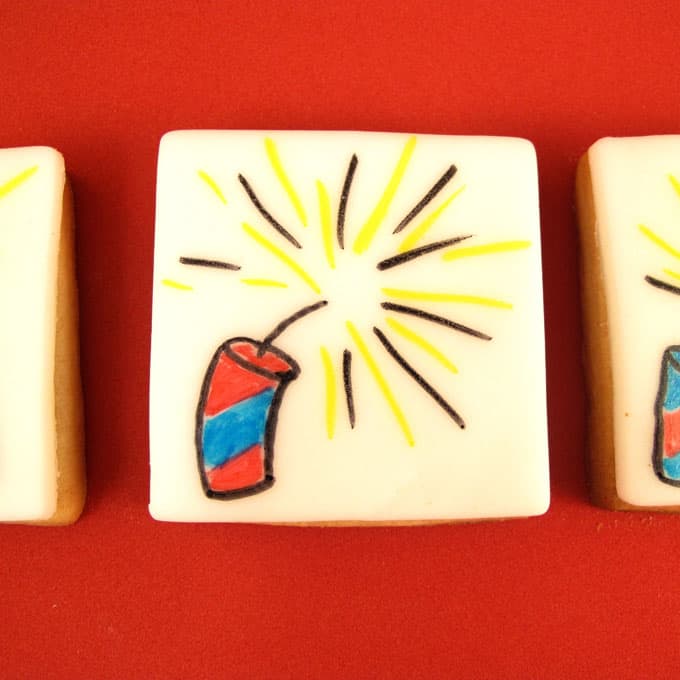 firecracker cookies for the 4th of July: How to draw a firecracker on a cookie topped with royal icing for fondant. 