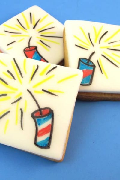 firecracker cookies for the 4th of July: How to draw a firecracker on a cookie topped with royal icing for fondant.