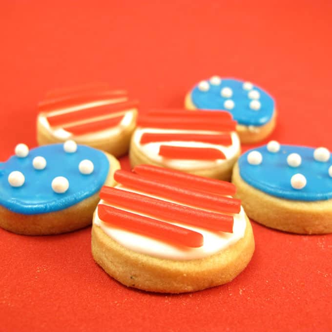 Stars and stripes cookies -- How to decorate bite-size 4th of July cookies with sprinkles and store-bought candy. #4thofJuly #DecoratedCookies #4thOfJulyCookies #StarsandStripes #AmericanFlag