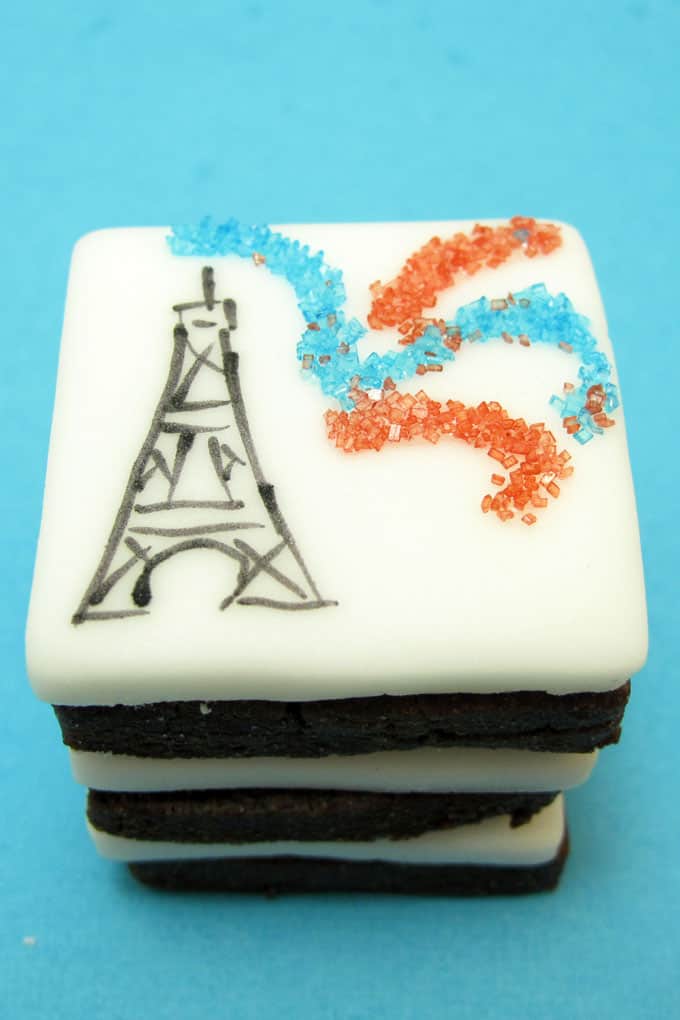 Bastille Day cookies: How to deocrate the Eiffel Tower and fireworks on cookies with fondant, food coloring pens, and sprinkles.