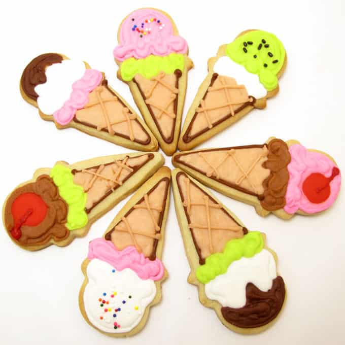 How to decorate ice cream cone cookies, a fun summer treat! Decorated sugar cookies with royal icing and sprinkles. 