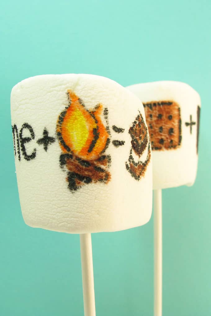 s'mores marshmallow art: how to draw "s'mores" on marshmallows with food coloring pens for a fun summer treat idea #smores #marshmallows #summer 