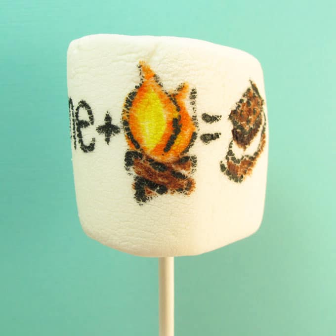 s'mores marshmallow art: how to draw "s'mores" on marshmallows with food coloring pens for a fun summer treat idea #smores #marshmallows #summer 