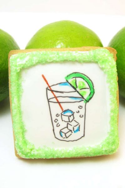 Gin and tonic cookies: How to use food coloring pens to draw a gin and tonic on decorated cookies flooded with royal icing. #ginandtonic #cookies #cookiedecorating