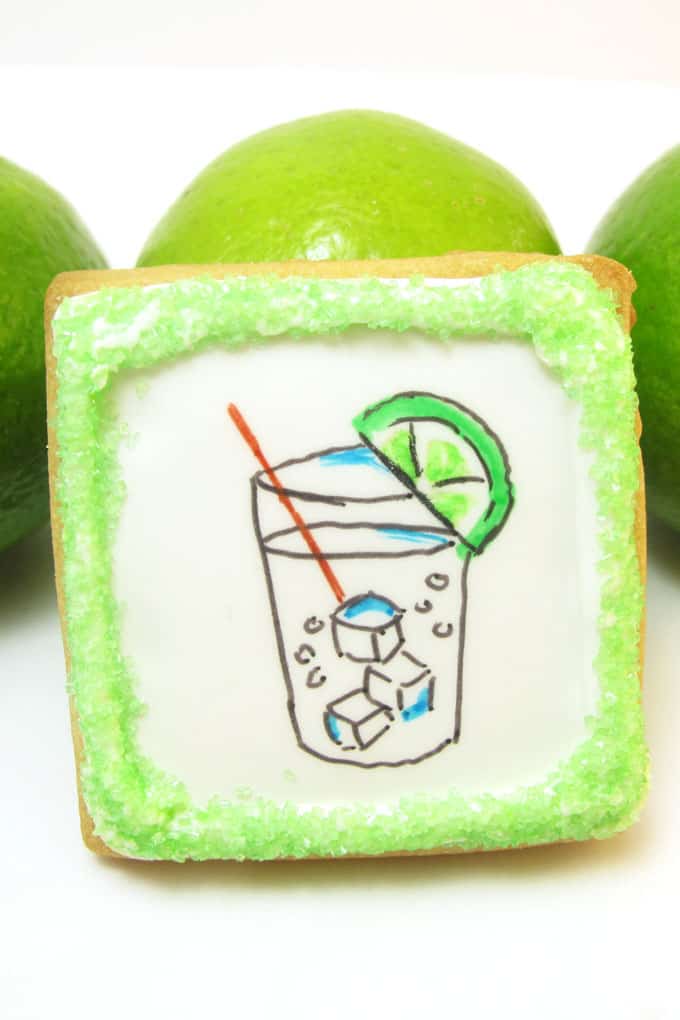 Gin and tonic cookies: How to use food coloring pens to draw a gin and tonic on decorated cookies flooded with royal icing. #ginandtonic #cookies #cookiedecorating