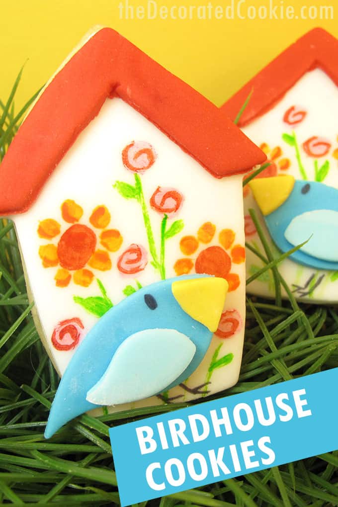 painted birdhouse cookies with yellow background