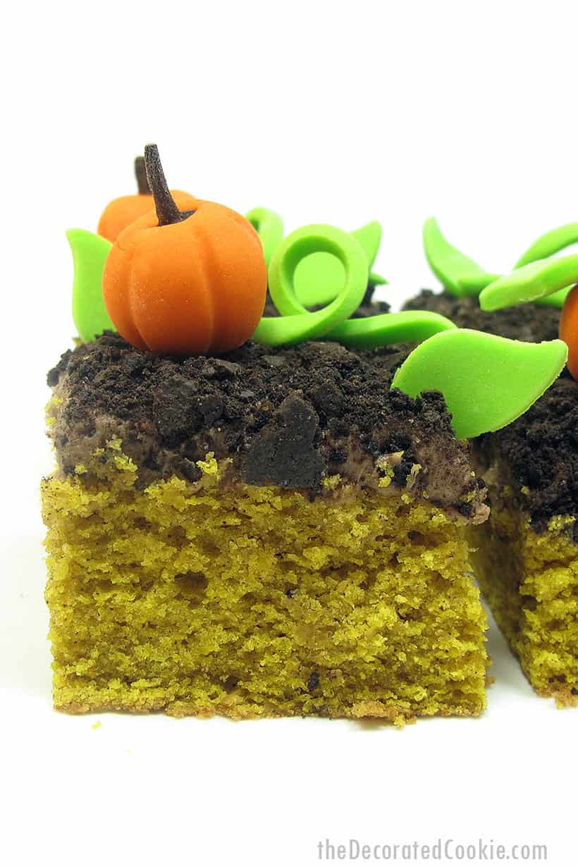 pumpkin cake with chocolate cream cheese frosting with a fondant pumpkin patch