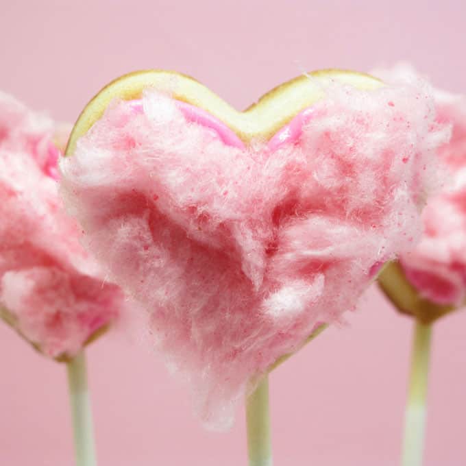 cotton candy heart cookie pops for Valentine's Day -- the decorated cookie #ValentinesDay #heartcookies #cookiepops #cottoncandy 