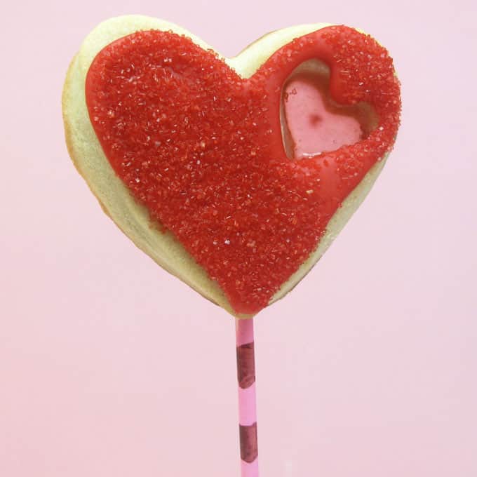 stained glass heart cookie pops for Valentine's Day -- the decorated cookie #ValentinesDay #cookies #heartcookies #stainedglasscookies 