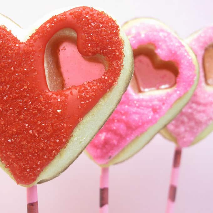 stained glass heart cookie pops for Valentine's Day -- the decorated cookie #ValentinesDay #cookies #heartcookies #stainedglasscookies 