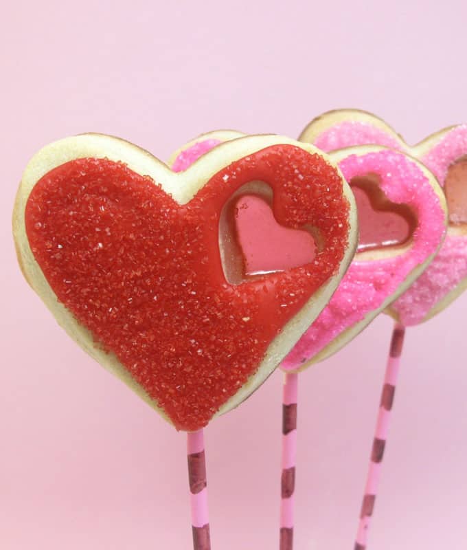 stained glass heart cookie pops for Valentine's Day -- the decorated cookie #ValentinesDay #cookies #heartcookies #stainedglasscookies 