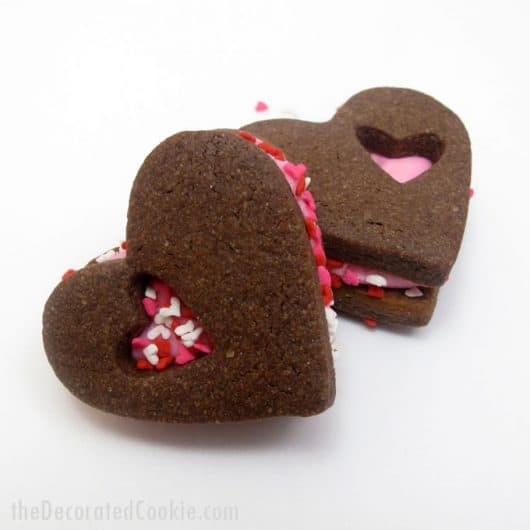 chocolate heart Valentine's Day sandwich cookies -- the Decorated Cookie #heartcookies #valentinesday #chocolatecookies #sandwichcookies #sprinkles