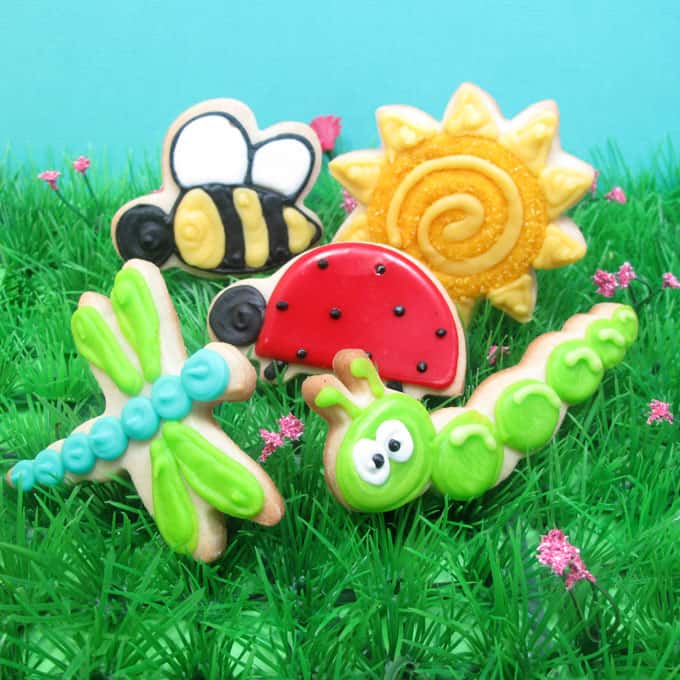 how to decorate sun cookies, daisy cookies, and happy bug cookies for Spring - the decorated cookie