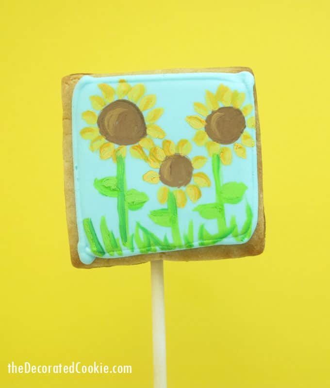 Painted sunflower cookies: How to paint on cookies with food coloring. 