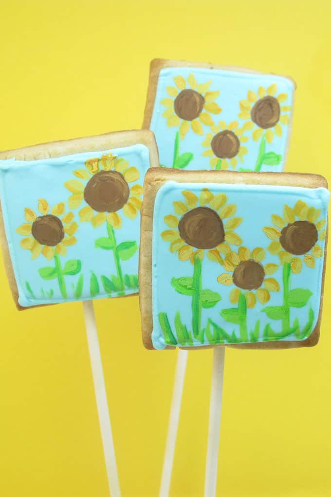 Painted sunflower cookies: How to paint on cookies with food coloring. 