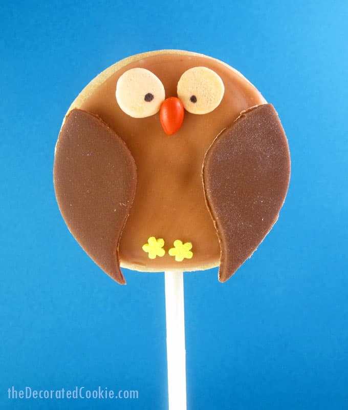 owl cookies on a stick with fondant and royal icing, a fun food treat for fall or Halloween -- the decorated cookie