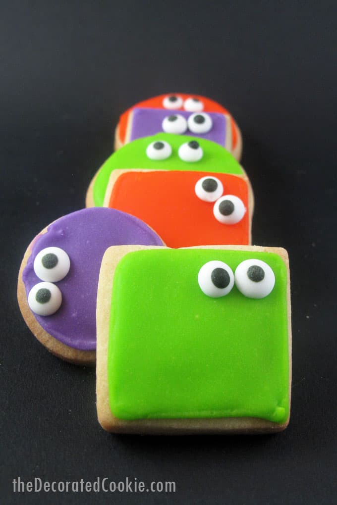 Super-simple googly-eyed monster cookies for a fun Halloween treat. Simple royal icing with store-bought candy eyes is a quick and easy way to decorate.