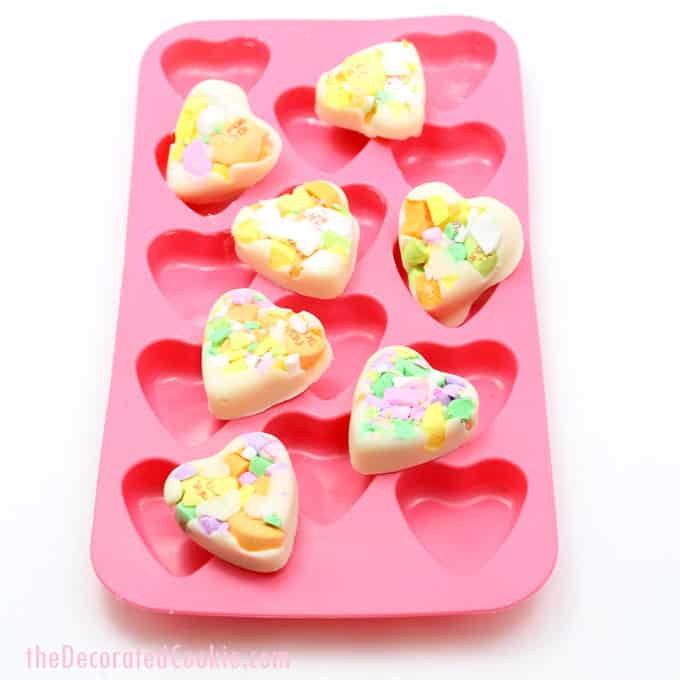Conversation heart chocolate bark for Valentine's Day is easy with a heart-shaped silicone mold. 