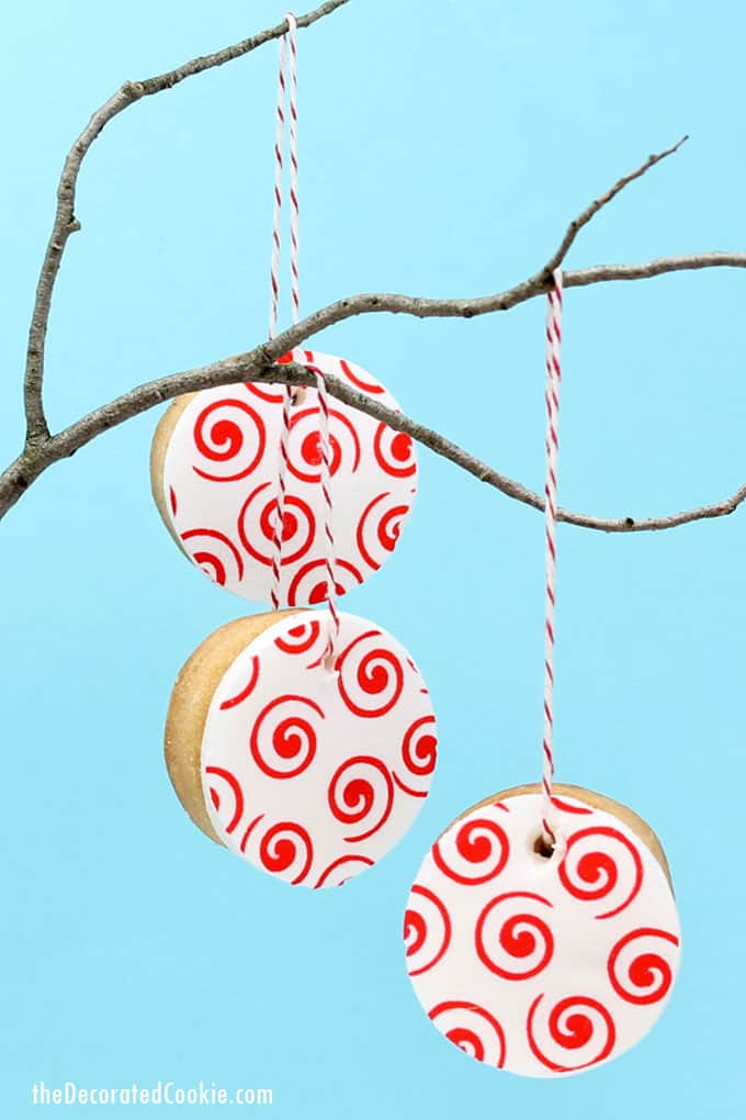 valentine's day cookie ornaments made with icing paper, fondant, and royal icing