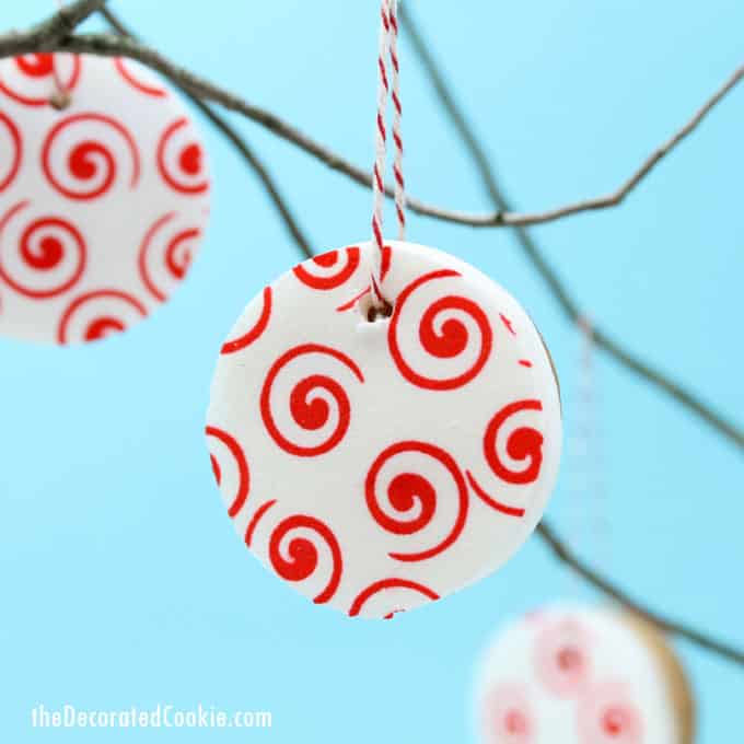 valentine's day cookie ornaments made with icing paper, fondant, and royal icing