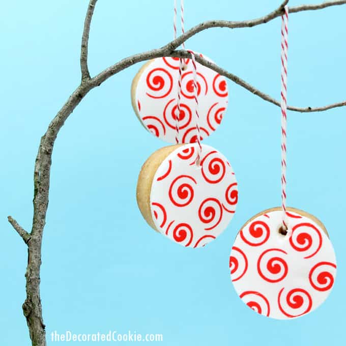 valentine's day cookie ornaments made with icing paper, fondant, and royal icing