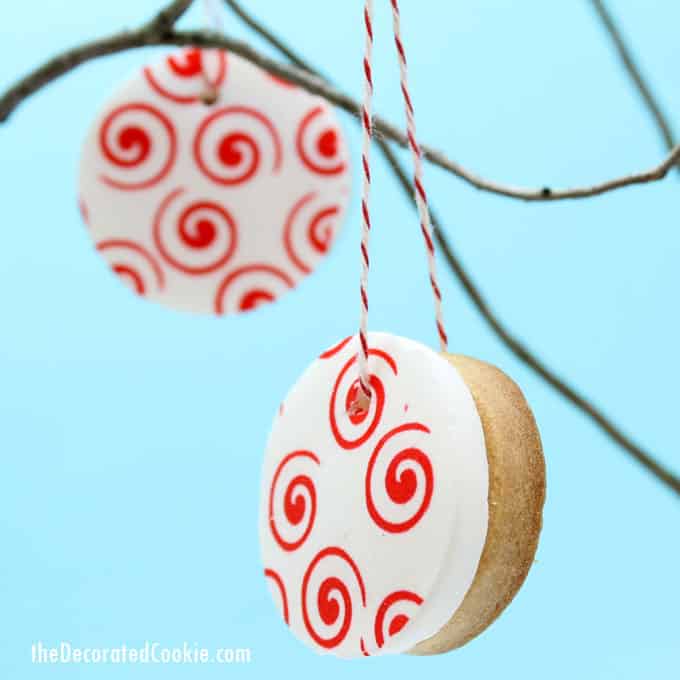 valentine's day cookie ornaments made with icing paper, fondant, and royal icing