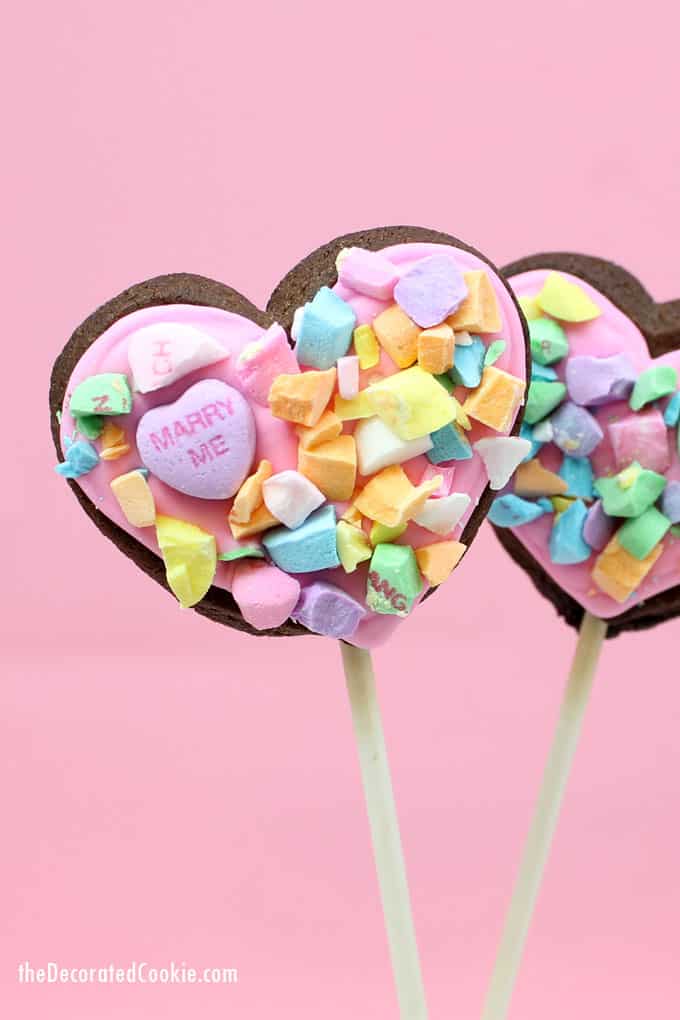 How to make crushed conversation heart cookies on a stick for Valentine's Day.  #ValentinesDaycookies #heartcookies #cookiepops #conversationhearts 