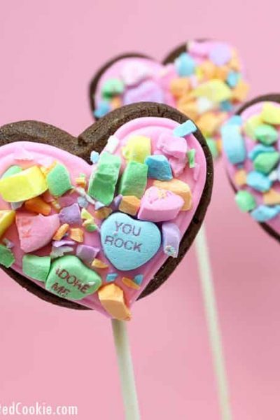 How to make crushed conversation heart cookies on a stick for Valentine's Day.  #ValentinesDaycookies #heartcookies #cookiepops #conversationhearts