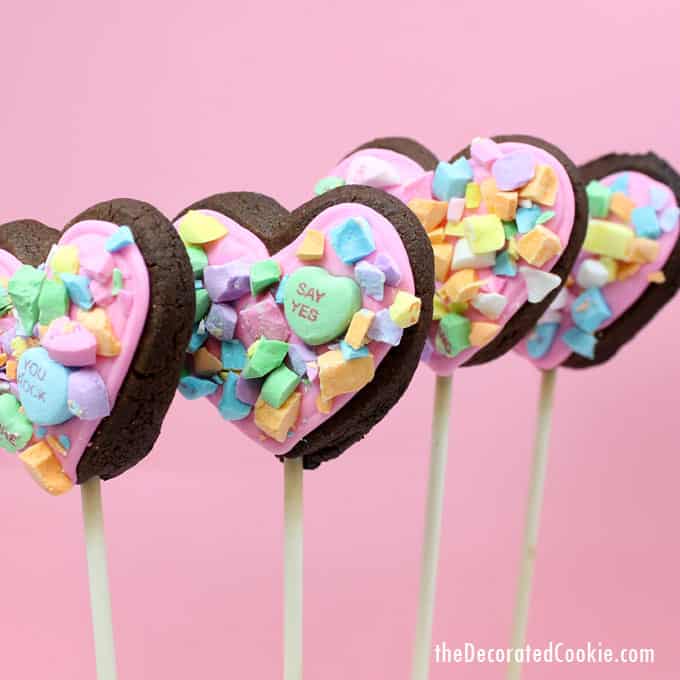 How to make crushed conversation heart cookies on a stick for Valentine's Day.  #ValentinesDaycookies #heartcookies #cookiepops #conversationhearts