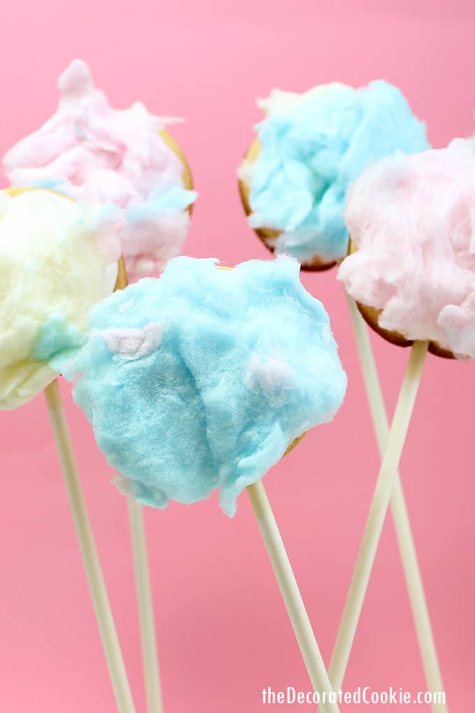 How to make fuzzy bunny tail cookie pops for a fun Easter treat. Top cut-out sugar cookie pops with royal icing and store-bought cotton candy.