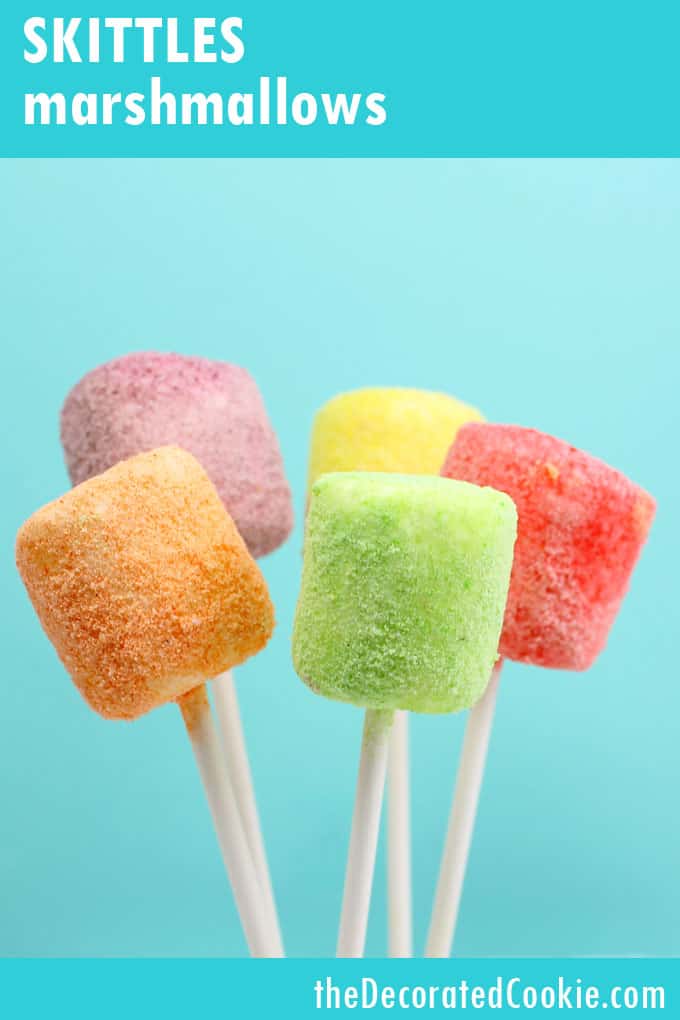 How to make skittles marshmallows on a stick:  rainbow marshmallow pops colored with ground Skittles candy, perfect unicorn food idea.
