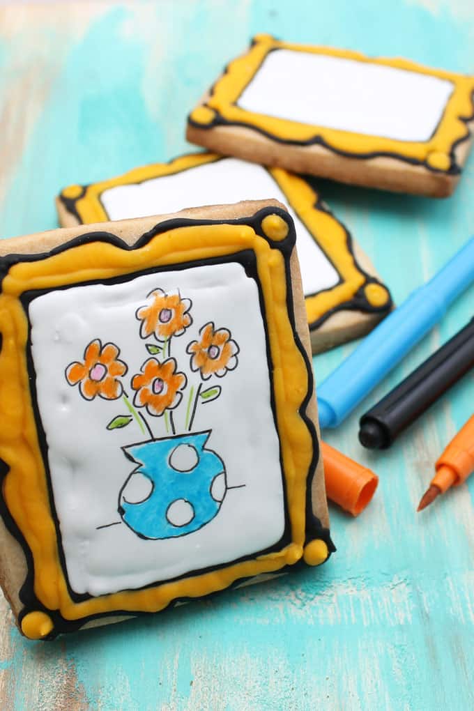 Art party favor idea: Decorate blank art canvas cookies to package as a party favor with food coloring pens so kids can decorate their own cookies.