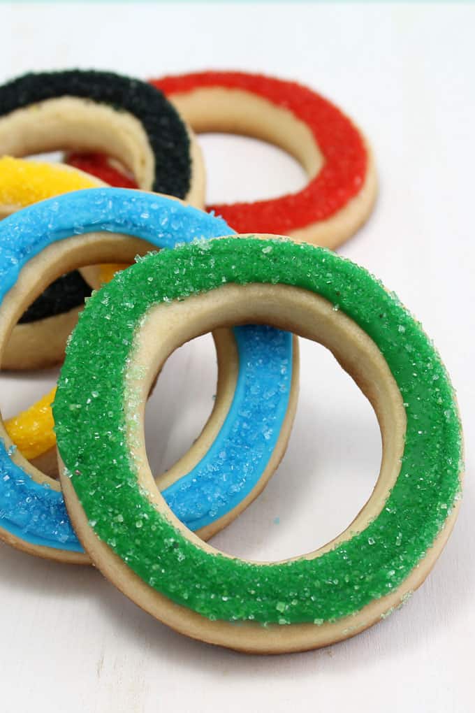 These simple, sparkly Olympics rings cookies are an easy, fun food idea for your Olympics party. Perfect for the Winter or Summer Olympics. Video how-tos.