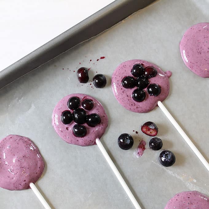 making blueberry frozen yogurt pops 