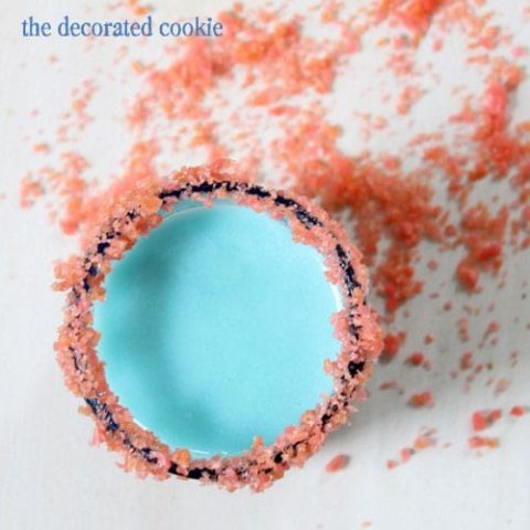 red and blue shooters for a 4th of July drink with a Pop Rocks rim