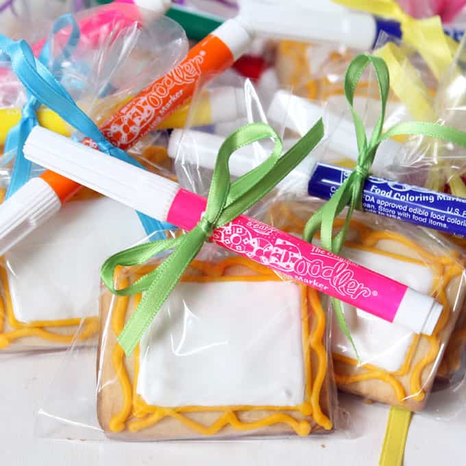  Decorate art canvas cookies and package with food coloring pens for art party favors. Kids design their own cookies.