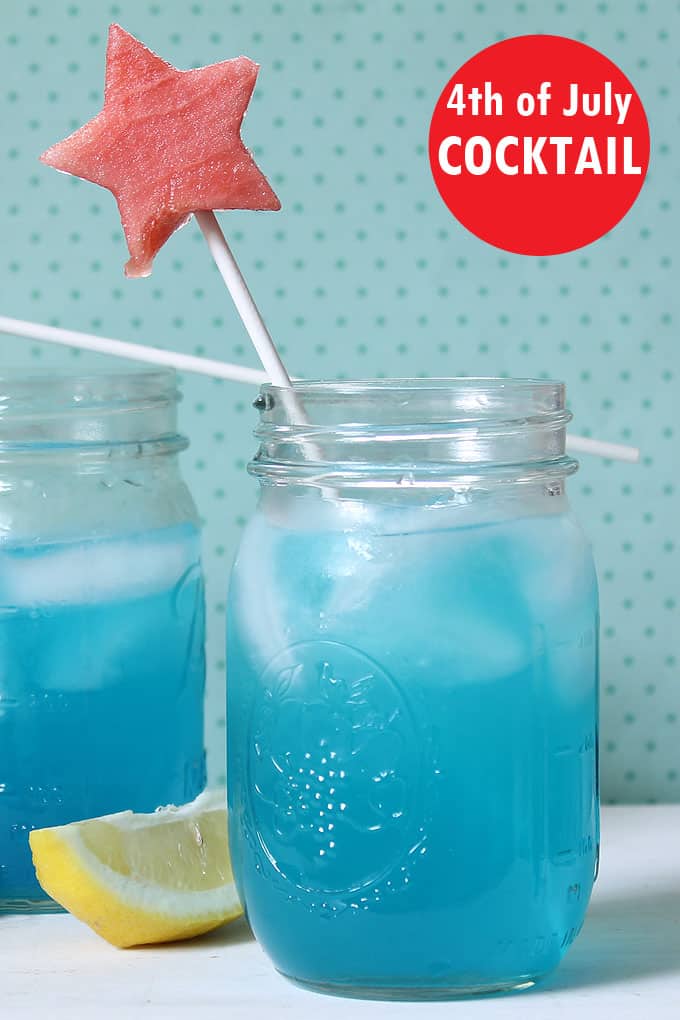 BLUE LEMONADE with watermelon star stirrers, a 4th of July drink made wither with or without alcohol for adults and kids alike.