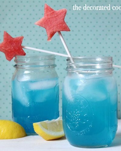 blue lemonade cocktail (booze optional) with watermelon star stirrer for the 4th of July
