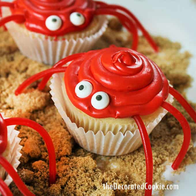 red crab cupcakes on brown sugar sand