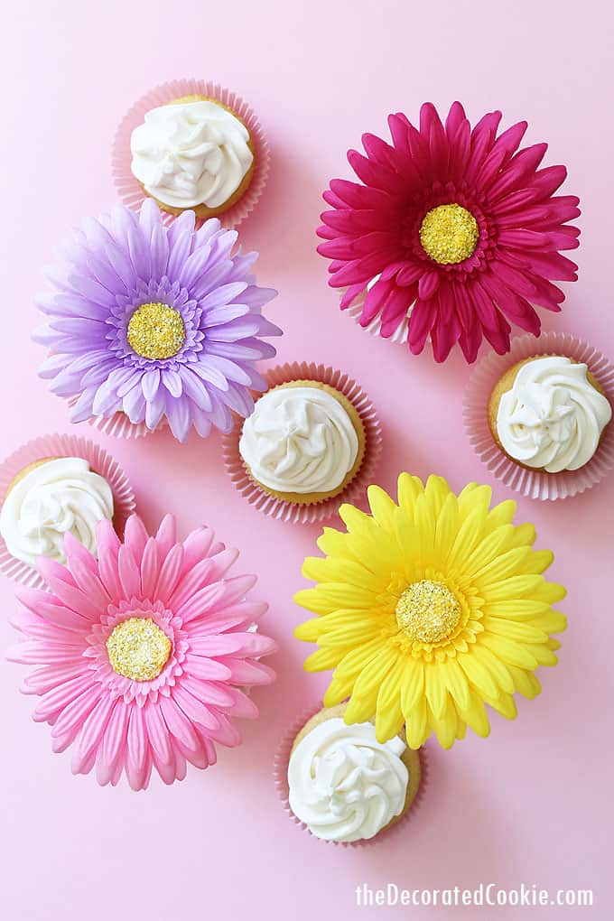 FLOWER CUPCAKE TOPPERS -- Dress up cupcakes with faux flowers. An easy way to decorate cupcakes for spring, a garden party, or a birthday.