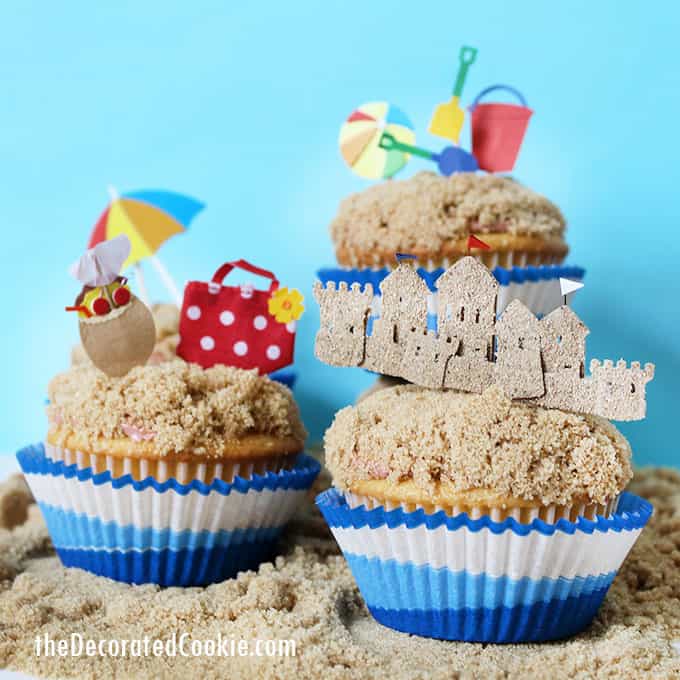 beach themed cupcakes on brown sugar sand 