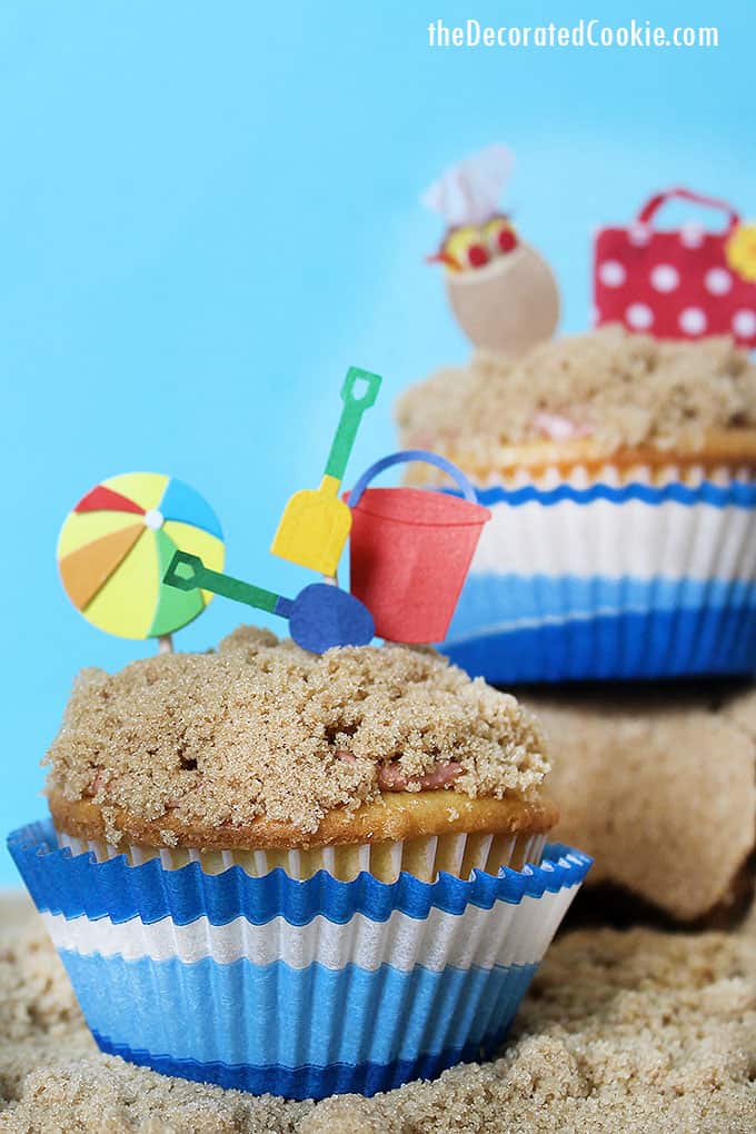 beach themed cupcakes on brown sugar sand 