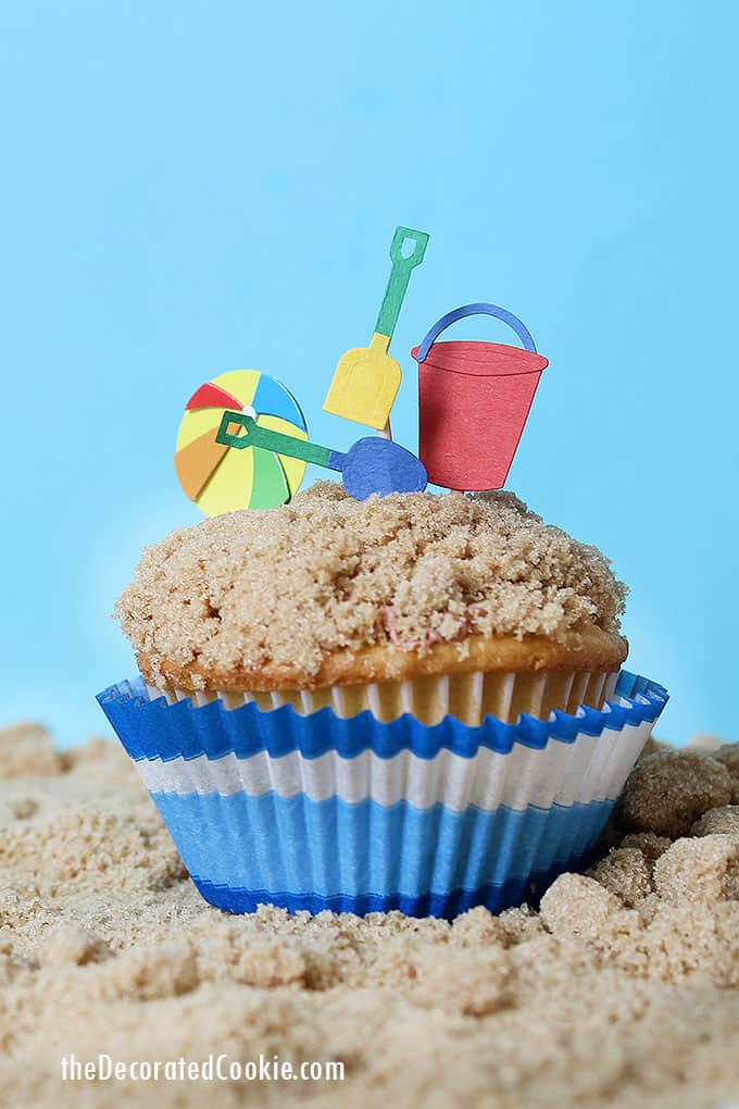 beach themed cupcakes on brown sugar sand 
