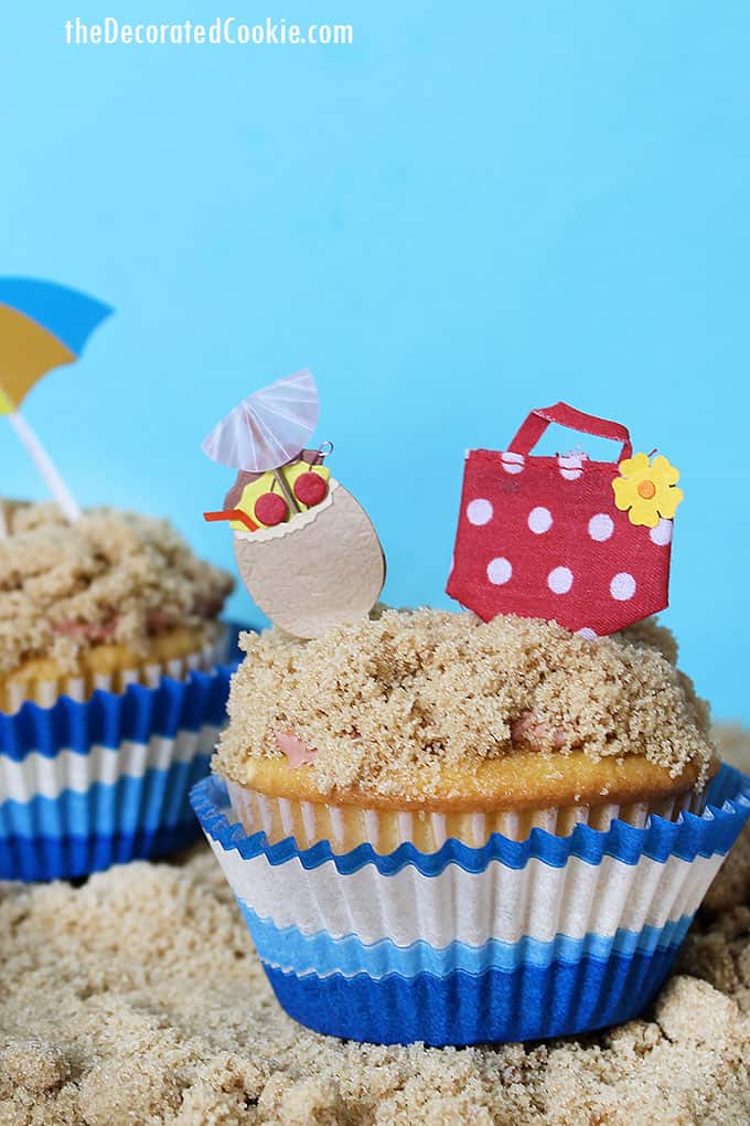 beach themed cupcakes on brown sugar sand 