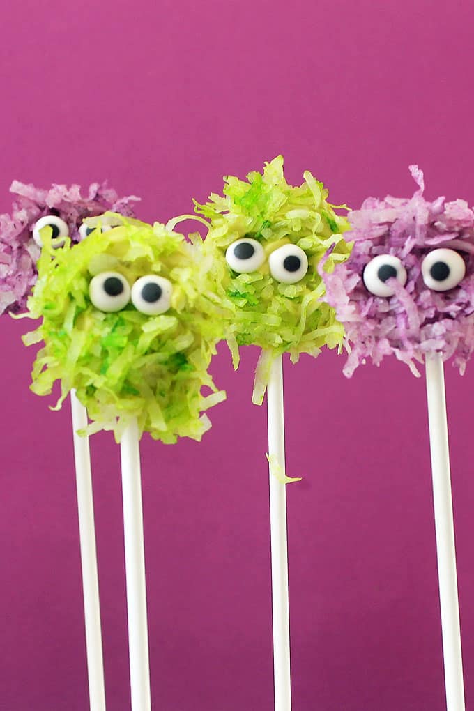 Fuzzy chocolate monsters pops combine coconut and chocolate on a stick, a cute and easy monster treat for your Halloween party food.