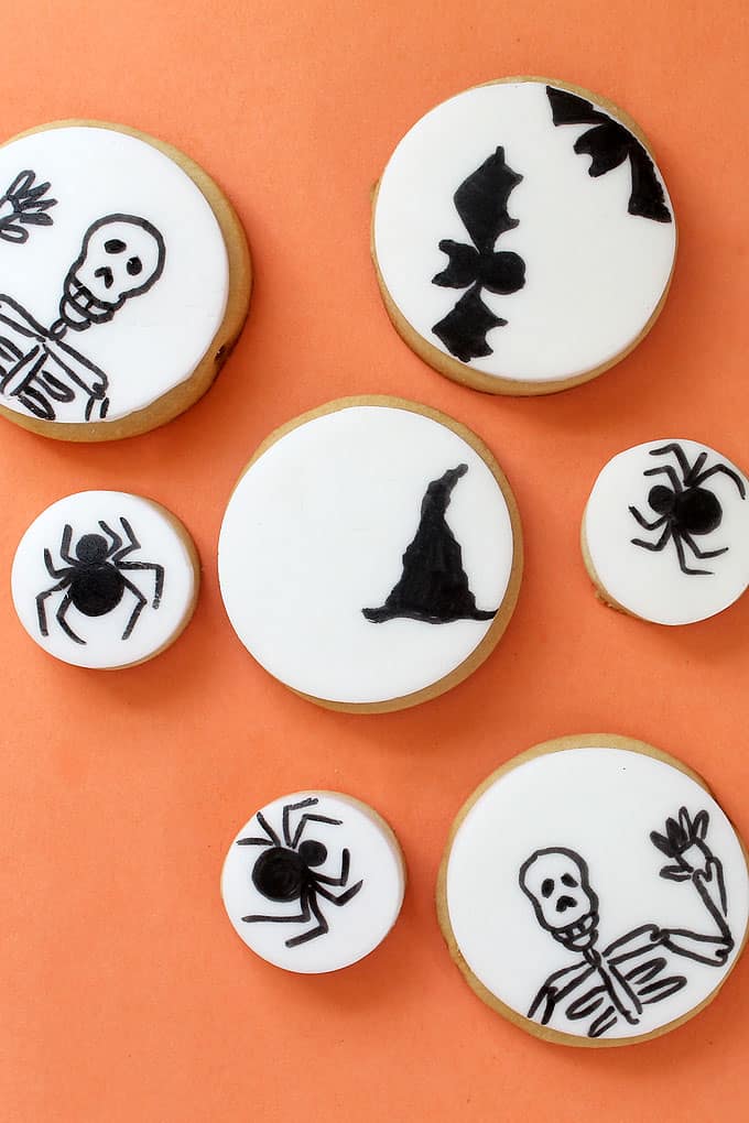 Make easy decorated Halloween cookies with just fondant and one black food coloring pen. Fun food for Halloween. Sweet Halloween treat idea.