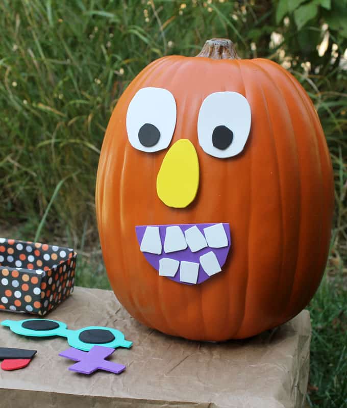 This "decorate me" Jack O' Lantern pumpkin face craft for kids is a fun and easy School Fall Fest activity. DIY Halloween game idea.