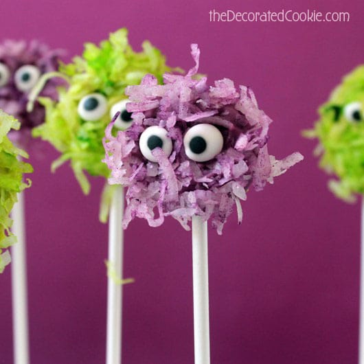 Fuzzy chocolate monsters pops combine coconut and chocolate on a stick, a cute and easy monster treat for your Halloween party food.