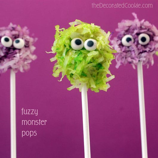 Fuzzy chocolate monsters pops combine coconut and chocolate on a stick, a cute and easy monster treat for your Halloween party food.